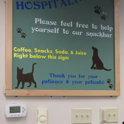 Poquoson Veterinary Hospital Snack Bar signage letting clients know to help themselves to their snackbar. They offer coffee, soda, and snacks.